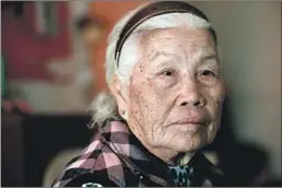  ??  ?? YANG YA, 87, pays $362 in rent for her single-room occupancy in Lincoln Heights. She survives on $900 a month she receives from Social Security.