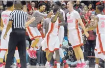  ?? MARLA BROSE/JOURNAL ?? UNM players react during Tuesday’s game in the Pit. The Lobos took a 78-73 decision to improve to 9-5 in the Mountain West Conference. Boise State, Colorado State and Nevada all have four MWC losses.