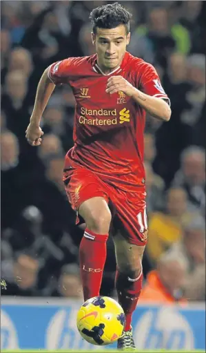  ??  ?? n Brazilian playmaker Philippe Coutinho demonstrat­es his dribbling ability.