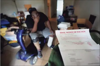  ?? Rebecca Blackwell / Associated Press ?? Freddie Davis, whose landlord raised his rent by 60 percent in the same month he lost his job as a truck driver, waits for a friend to arrive to help him move his remaining belongings to a storage unit, after receiving a final eviction notice at his one-bedroom apartment on Sept. 29 in Miami.