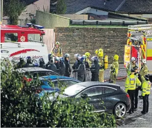  ?? Picture: Paul Reid. ?? Riot officers with other emergency workers at the scene.