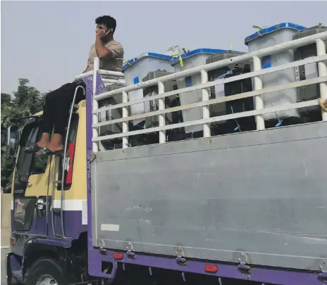  ?? AP ?? Ballot boxes arrive by lorry for their contents to be manually counted at a centre in Baghdad yesterday