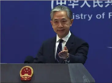  ?? LIU ZHENG — THE ASSOCIATED PRESS ?? In this image made from video, Chinese Foreign Ministry spokespers­on Wang Wenbin gestures as he speaks during a media briefing at the Ministry of Foreign Affairs office in Beijing on Monday.