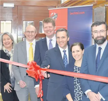  ??  ?? >
Bechtel infrastruc­ture president Craig Albert (cutting the ribbon) and UK managing director Paul Gibbs (on his Craig’s right) at the opening of the company’s new office in Birmingham city centre