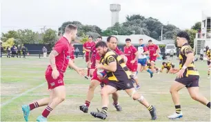  ?? Photos / Bruce Falloon ?? Dave McErlean on the charge with Connor Paki in support, during his 150th game for the club.