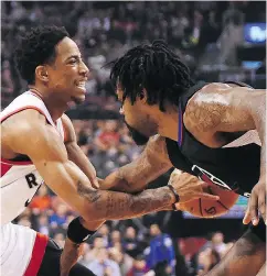  ?? FRANK GUNN / THE CANADIAN PRESS ?? DeMar DeRozan battles for the ball with L.A.’s DeAndre Jordan in Toronto on Monday night.