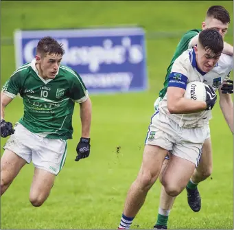  ??  ?? O’Conor of St Farnan’s in action with Curry’s Michael Gordon in Kilcoyne Park. Pic: Tom Callanan.