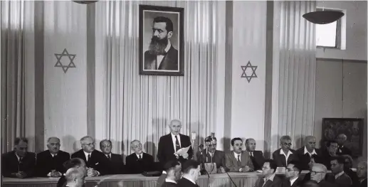  ??  ?? DAVID BEN-GURION reads the Declaratio­n of Independen­ce in 1948.