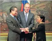  ??  ?? External affairs minister Sushma Swaraj greets her Chinese counterpar­t Wang Yi and Russian foreign minister Sergey Lavrov in Moscow on Monday. AP PHOTO