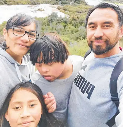  ??  ?? Aaron Te Runa (right) and Kataraina Werahiko (left) with their son, 18, who has Down syndrome and autism, and daughter, 9, who also has autism. The couple do not want them named.
