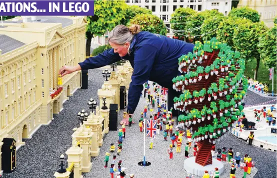  ?? ?? Nature’s pick: The recently installed Tree of Trees is included in this Lego model of Buckingham Palace complete with tourists