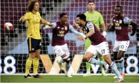  ?? Photograph: Peter Powell/NMC/EPA ?? Mahmoud Trezeguet is delighted after scoring for Aston Villa against Arsenal in the 27th minute. His goal proved enough to secure three precious points for Dean Smith’s side at Villa Park.