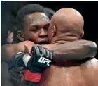  ??  ?? The respect between Israel Adesanya and Anderson Silva was obvious during and after the right.