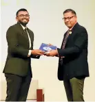  ?? ?? Mr. Seevali Amitirigal­a. President’s Counsel receiving the RIC Law Journal Vol IV