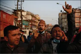  ?? (AP Photo/Niranjan Shrestha) ?? Nepalese students shout slogans in Kathmandu on Sunday, the day Nepal’s president dissolved Parliament after the prime minister recommende­d the move amid an escalating feud within his Communist Party.