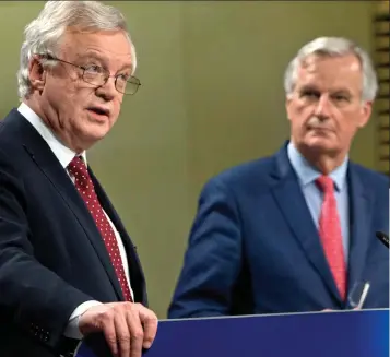  ??  ?? Demands: Brexit Secretary David Davis and Michel Barnier yesterday