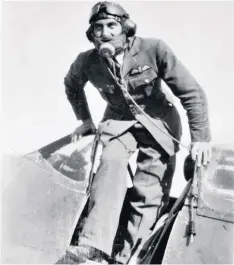  ??  ?? Lawrence climbing out of his Spitfire: he showed ‘great courage and outstandin­g keenness especially when the odds were great’