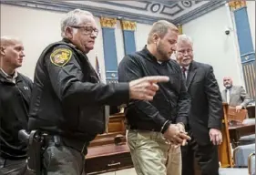  ?? Lake Fong/Post-Gazette ?? Jeriah Mast, 38, of Millersbur­g, Ohio, a former missionary for Christian Aid Ministries, is led out of court Tuesday after being sentenced by Judge Robert Rinfret to nine years in prison for molesting boys.