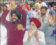  ?? SAMEER SEHGAL/HT ?? Punjab local bodies minister Navjot Singh Sidhu with Punjab Arts Council chairperso­n Surjit Patar during a function held in the memory of Punjabi poet Dhani Ram Chatrik in Lopoke near Amritsar on Sunday.