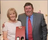  ??  ?? Billy Nelson receives his prize from Lady President of Blainroe Golf Club Bernie Nelson.