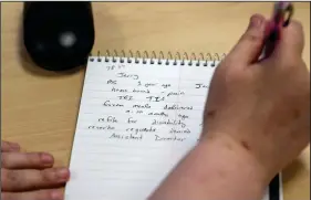  ?? Bonnie Jo Mount/Washington Post ?? LEFT: An agent takes notes on a veteran’s problems. The hotline has received more than 107,000 calls since June 2017.