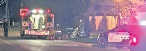  ?? GREG FURMINGER / STANDARD STAFF FILE PHOTO ?? Police and emergency crews at the scene of a triple-shooting in Fenwick in October 2015.