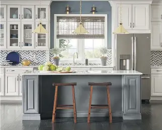  ?? HOMEDEPOT.CA ?? Thomasvill­e’s Camden kitchen island in a trendsetti­ng fossil grey finish adds an additional work surface and looks like a separate piece of furniture in a neutral kitchen.