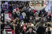  ?? THE ASSOCIATED PRESS ?? Shoppers are seen crowded into a Macy's store.