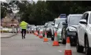  ?? Photograph: Carly Earl/The Guardian ?? Long queues of cars snaked around the Fairfield Showground Covid-19 testing site.