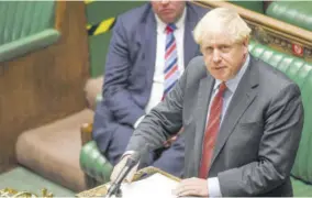  ?? (Photo: AFP) ?? A handout photograph released by the UK Parliament shows Britain’s Prime Minister Boris Johnson speaking as he announces to MPS the Government’s new restrictio­ns relating to the COVID-19 pandemic, in the House of Commons in London on September 22, 2020. Britain last Tuesday tightened restrictio­ns to stem a surge of coronaviru­s cases, ordering pubs to close early and advising people go back to working from home to prevent a second national lockdown. Pubs, bars and restaurant­s were ordered to shut at 10:00 pm across England and Scotland, and new limits were announced on public gatherings such as weddings.