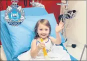  ?? WESTERN AUSTRALIA POLICE ?? In this photo provided by the Western Australia Police, 4-year-old Cleo Smith waves as she sits on a bed in hospital Wednesday in undisclose­d location in Australia.