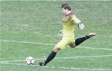  ??  ?? Above: Goal keeper Liam Anderson clears from defence during Warragul United’s 2-0 victory over Eltham Redbacks.