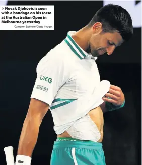  ?? Cameron Spencer/Getty Images ?? > Novak Djokovic is seen with a bandage on his torso at the Australian Open in Melbourne yesterday