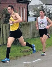  ??  ?? ●●Patrick Martin, left, taking part in the Wrexham half marathon.