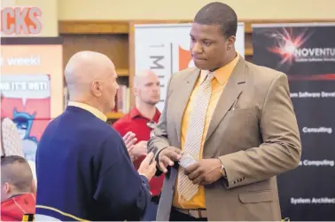  ?? MARLA BROSE/JOURNAL ?? Jason Jones of Suriname, right, gets advice from John Meluso during a meeting at 1 Million Cups. Jones is among 10 entreprene­urs from Latin American and Caribbean countries visiting Albuquerqu­e.