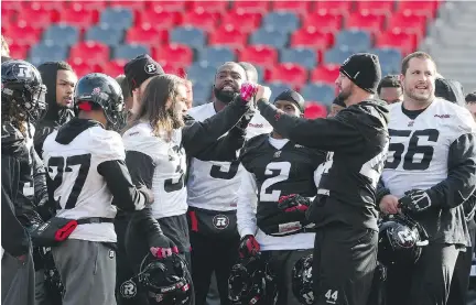  ?? JEAN LEVAC/ OTTAWA CITIZEN ?? The Ottawa Redblacks did some team bonding at their practice at TD Place on Friday as Sunday’s big game nears.