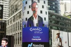  ?? Nasdaq MarketSite via AP ?? In this photo taken from video provided by Nasdaq, CureVac CEO FranzWerne­r Haas is shown on the Nasdaq MarketSite video facade in Times Square, virtually ringing Friday’s closing bell.