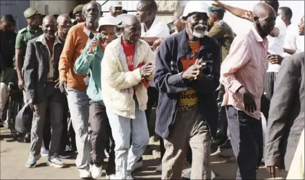  ?? ?? Free at last... Part of the pardoned inmates make their way out of Harare Central Prison recently. Pictures: Shepherd Tozvireva