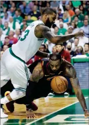  ?? ASSOCIATED PRESS ?? CLEVELAND CAVALIERS FORWARD LeBron James (23) loses the ball out of bounds under defensive pressure from Boston Celtics forward Marcus Morris (13) during Game 5 of the NBA Eastern Conference finals Wednesday in Boston.
