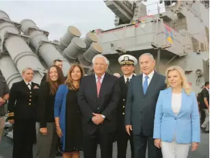  ?? (Marc Israel Sellem/The Jerusalem Post) ?? PRIME MINISTER Benjamin Netanyahu and his wife, Sara, and US Ambassador David Friedman and his wife, Tammy, and his daughter Talia are led on a tour of the ‘USS Ross’ yesterday by Commanding Officer Cmdr. David Coles at the Ashdod port.