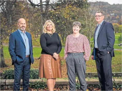  ?? ?? STRONG YEAR: Space Solutions founder and chairman Steve Judge, business developmen­t director Victoria Walker, director of finance and support services Teresa Thomson and group managing director Jim Mathieson.