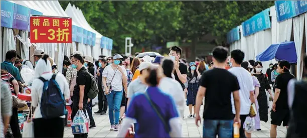  ?? PROVIDED TO CHINA DAILY ?? People attend the Beijing Book Fair at Chaoyang Park in May. The event, which attracted more than 300,000 visitors, has been held annually since 1979.