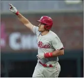  ?? JOHN BAZEMORE — THE ASSOCIATED PRESS ?? J.T. Realmuto gave the Phillies a 3-0lead with a two-run homer, but the Braves rallied to win Game 2 on Monday.