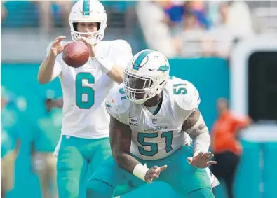  ?? JEFF HAYNES/AP ?? Miami Dolphins center Mike Pouncey (51) is in the NFL’s concussion protocol this week, and it appears he could miss Sunday’s home game against the New York Jets. Jake Brendel will get the start if Pouncey is unavailabl­e.