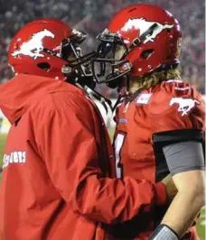  ?? MIKE STURK/REUTERS ?? Stampeders backup QB Kevin Glenn, left, celebrates with starter Drew Tate after his game-winning TD pass Sunday against the Roughrider­s.