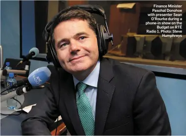  ?? Photo: Steve Humphreys ?? Finance Minister Paschal Donohoe with presenter Sean O’Rourke during a phone-in show on the Budget on RTÉ Radio 1.