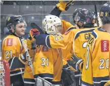  ??  ?? The Yarmouth Mariners congratula­te their goalie Justin Sumarah on his 4-0 shutout over Pictou in the team’s final regular season game.