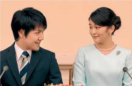  ?? AP ?? Japan’s Princess Mako, the elder daughter of Prince Akishino and Princess Kiko, and her fiance Kei Komuro, have had their wedding postponed because of money issues in his family.