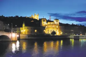  ?? Rick Steves ?? In Lyon, state-of-the-art floodlight­ing enhances the city’s architectu­re.