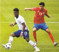  ?? Alex Goodlett / Getty Images ?? U.S. midfielder Yunus Musah, who plays for Spanish club Valencia, dribbles in front of Costa Rica’s Yeltsin Tejeda.